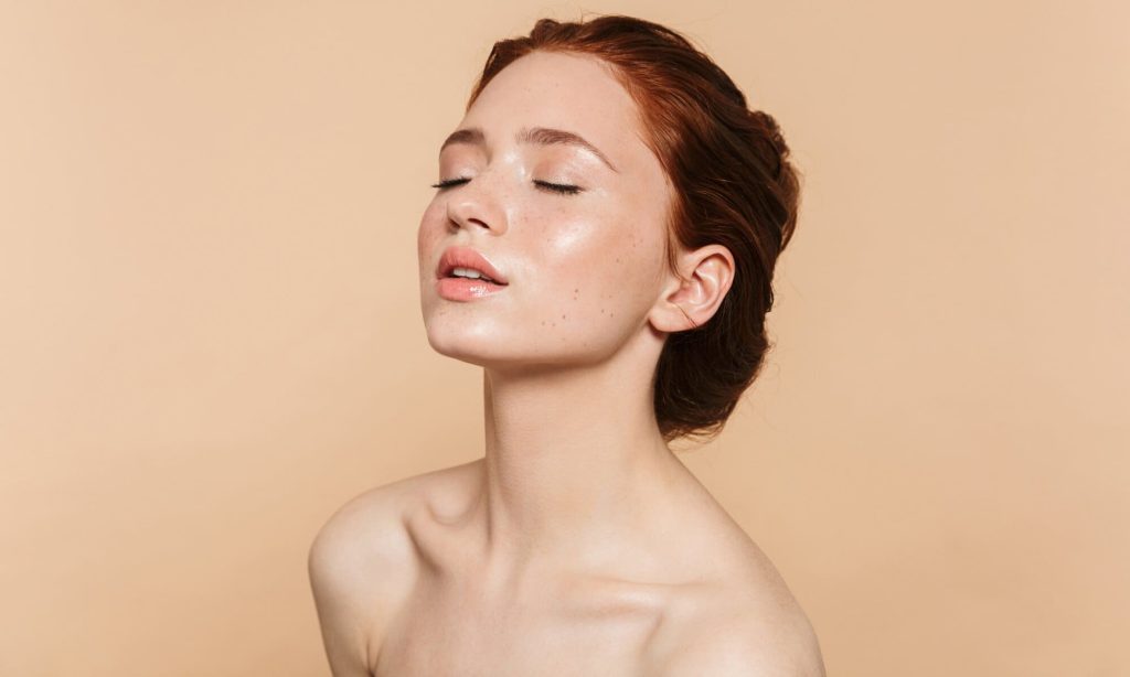 Young woman with smooth, natural-looking facial volume after Juvederm filler treatment at PUR Skin Clinic