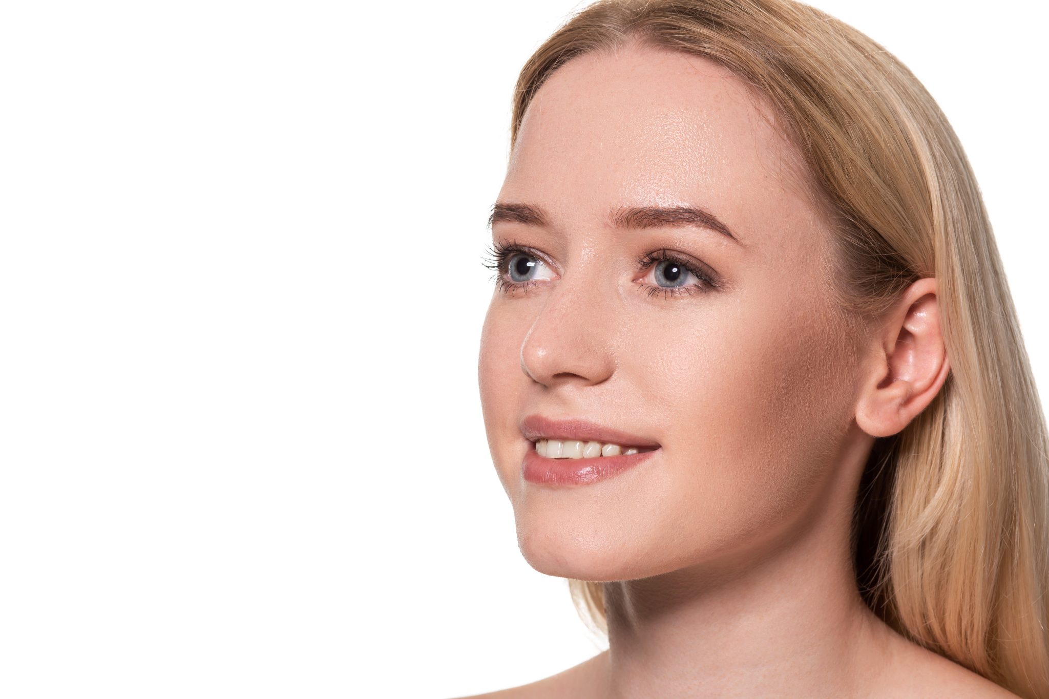 Blonde woman with smooth, even skin tone after IPL photofacial treatment at PUR Skin Clinic