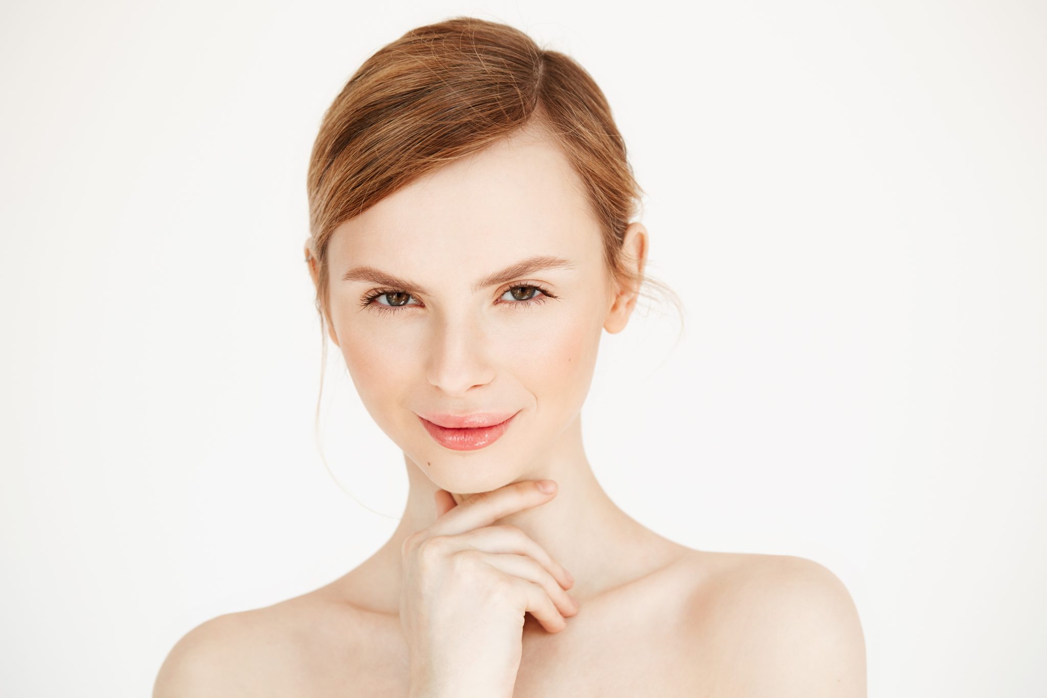 Confident young woman with youthful volume and smooth skin after Sculptra Aesthetic treatment at PUR Skin Clinic