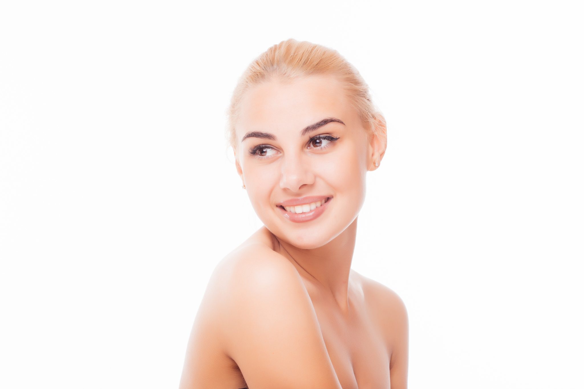 Smiling young woman with clear, glowing skin after professional acne treatment at PUR Skin Clinic, highlighting a blemish-free complexion and healthy radiance.