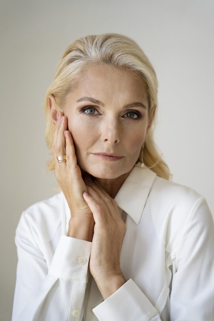 Elegant middle-aged woman with firm, youthful skin after advanced skin tightening treatment at PUR Skin Clinic