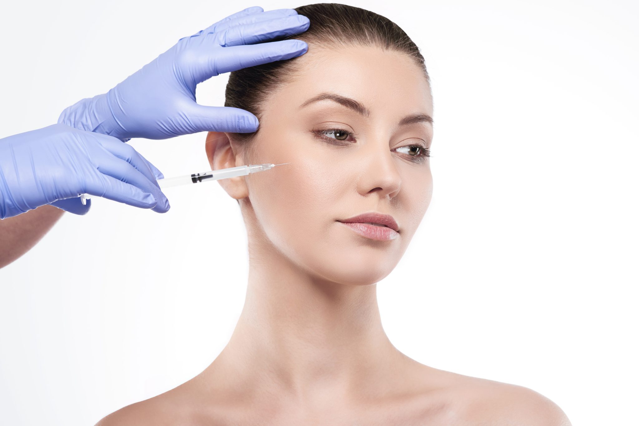 Professional Juvederm filler injection being administered at PUR Skin Clinic for natural facial enhancement