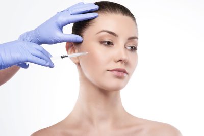 Professional Juvederm filler injection being administered at PUR Skin Clinic for natural facial enhancement