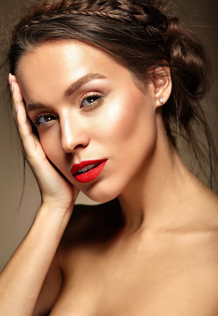 Young woman with bright, clear complexion and healthy skin glow from Clear + Brilliant treatment at PUR Skin Clinic