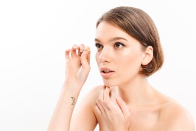 Young woman with clear, radiant complexion after IPL photofacial treatment at PUR Skin Clinic