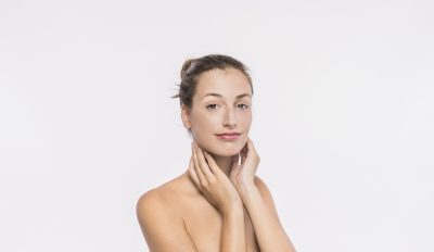 Young woman with clear, radiant skin after SkinPen microneedling treatment at PUR Skin Clinic