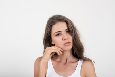 Young woman with clear, smooth skin and improved texture after laser resurfacing at PUR Skin Clinic
