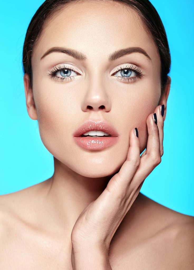 Young woman with flawless, radiant complexion after BBL Hero IPL treatment for sun damage
