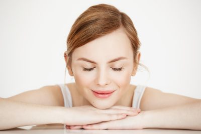 Young woman with smooth, natural-looking results after dermal filler treatment at PUR Skin Clinic